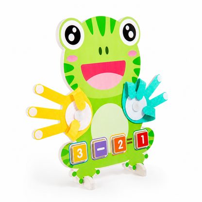 The Frog Math Puzzle is a green, frog-shaped Montessori math toy featuring foam hands, numbers, and math signs on its body, designed to help children learn counting and basic math skills.