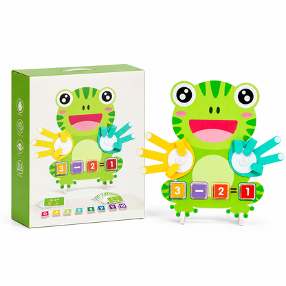 A Frog Math Puzzle featuring a green frog design sits next to its box, along with colorful number blocks and hands. The box displays the same frog character and highlights included cards, math symbols, and Montessori-inspired learning features.